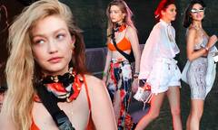 Gigi Hadid flashes toned abs in orange crop top with Kendall ...