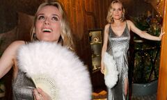 Diane Kruger stuns in a glitzy thigh slit gown as she waves a ...