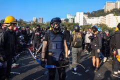 Hong Kong: Protesters fortify Chinese University as chaos spreads ...