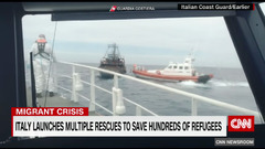 Rescue workers race to save 400 migrants adrift on boat in ...