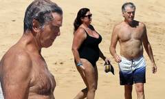 Pierce Brosnan, 66, and wife Keely Shaye Smith frolic on Hawaiian ...