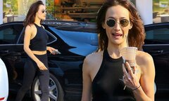 Maggie Q flashes flat stomach in teeny crop top and leggings ...