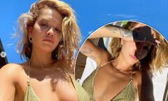 Rita Ora flaunts her assets in a green bikini as she soaks up the ...