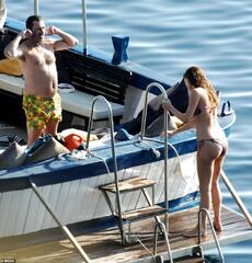 Jon Hamm, 50, dons tiny shorts with bikini-clad Anna Osceola, 33 ...