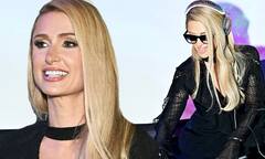 Paris Hilton cuts a chic figure in a plunging black dress as she ...