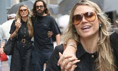 Heidi Klum cozies up to her husband Tom Kaulitz as the two take a ...