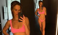 Bar Refaeli showcases her washboard abs as she poses in a skimpy ...