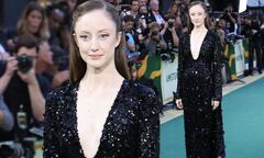 Andrea Riseborough stuns in a plunging sequined gown at the UK ...