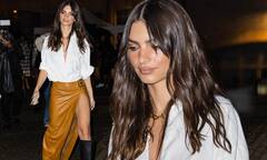 Emily Ratajkowski shows a lot of leg in a daring leather skirt ...