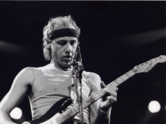 Mark Knopfler (Mark Knopfler Dire Straits guitar rock legend with head band ) (David Knopfler)