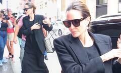 Angelina Jolie turns heads in a figure-hugging black dress and ...