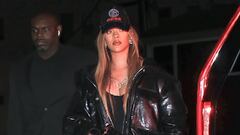 Rihanna cuts an edgy figure in a long leather coat and sequined ...