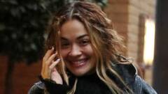 Rita Ora covers up in a cropped denim jacket and jeans as she ...