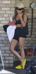 Rita Ora flaunts her super toned physique in a crop top and shorts ...