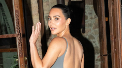 Kim Kardashian flaunts her enviable curves in sheer backless grey ...