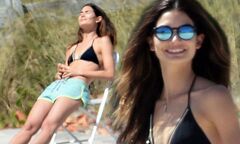 Lily Aldridge soaks up the sun in a tiny string bikini as she ...