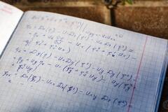 Handwriting of mathematics quadratic equation formula on ...