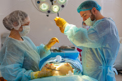 Hospital surgeon operates in the featuring surgery, breast, and implant