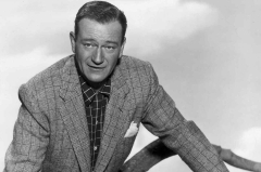 John Wayne (John Wayne Looking Away and wearing a Black Suit and Tie Photo )