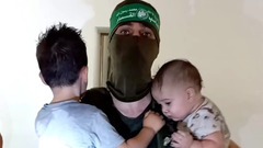 Hamas militants playing with captured Israeli children in shocking ...