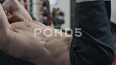 Young man doing abs exercise and flexing... | Stock Video | Pond5