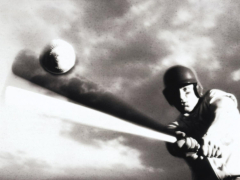 Low Angle View of a Baseball Player Swinging a Baseball Bat