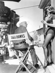 RIO BRAVO, 1959 directed by HOWARD HAWKS On the set, Hohard Hawks directs Angie Dickinson (b/w phot